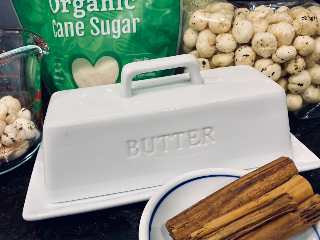 Butter, sugar, cinnamon and fox nuts on a kitchen counter